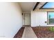 Inviting front entrance with security door, tasteful landscaping, and pathway leading to the front door at 806 W El Alba Way, Chandler, AZ 85225