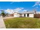 Well-kept single-story residence with green lawn, an attached garage and black trimmed windows at 806 W El Alba Way, Chandler, AZ 85225