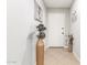 Warm entryway featuring neutral tile, a large ornamental vase, and charming decor at 806 W El Alba Way, Chandler, AZ 85225