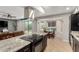 Kitchen and dining area with granite countertops, stainless steel appliances, and open floor plan at 806 W El Alba Way, Chandler, AZ 85225