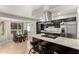 Kitchen with stainless steel appliances, granite countertops, dark cabinetry, and seating at the island at 806 W El Alba Way, Chandler, AZ 85225