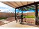 Outdoor patio area with a grill and ample space for entertaining in the backyard at 806 W El Alba Way, Chandler, AZ 85225