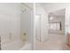 Bright bathroom featuring a tile-surround tub and shower combination at 9032 W Sierra Pinta Dr, Peoria, AZ 85382