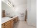 Bright bathroom features a long countertop with dual sinks, cabinets, and a shower/tub combo at 9032 W Sierra Pinta Dr, Peoria, AZ 85382