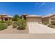Beautiful home with a two-car garage and attractive landscaping at 9032 W Sierra Pinta Dr, Peoria, AZ 85382