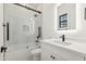 Stylish bathroom features subway tile, glass shower door, and modern vanity with illuminated mirror at 915 W Ardmore Rd # 11, Phoenix, AZ 85041