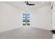 Bright, carpeted bedroom features a large window, offering great natural light at 915 W Ardmore Rd # 11, Phoenix, AZ 85041