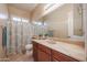 Bathroom featuring a vanity with a sink, a toilet, and a shower with a patterned curtain at 9698 S 183Rd Ave, Goodyear, AZ 85338