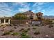 Elegant stone signage for Presidio Residents Club with mountain views and blue sky at 9698 S 183Rd Ave, Goodyear, AZ 85338