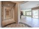Welcoming foyer with tile flooring leading to a spacious living area and kitchen at 9698 S 183Rd Ave, Goodyear, AZ 85338