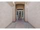 Inviting entryway with decorative security door and desert landscaping at 9698 S 183Rd Ave, Goodyear, AZ 85338