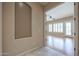 Hallway view into the bedroom with hardwood floors, shuttered windows, and ceiling fan at 9698 S 183Rd Ave, Goodyear, AZ 85338
