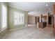 View of kitchen with wood cabinets, tile floor, open floor plan, and a view to the backyard at 9698 S 183Rd Ave, Goodyear, AZ 85338