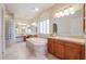 Bright main bathroom features tile floors, dual sink vanity, soaking tub, and lots of counter space at 9698 S 183Rd Ave, Goodyear, AZ 85338