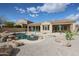 Inviting backyard pool area with desert landscaping, perfect for outdoor relaxation and entertaining at 9698 S 183Rd Ave, Goodyear, AZ 85338