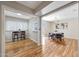 Dining area with a breakfast bar, hardwood floors, modern light fixture and plenty of natural light at 10713 W Santa Fe Dr, Sun City, AZ 85351