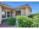 Charming home exterior featuring lush landscaping and well-maintained facade at 10713 W Santa Fe Dr, Sun City, AZ 85351
