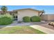 Charming single-story home with desert landscaping and a well-maintained front yard at 10713 W Santa Fe Dr, Sun City, AZ 85351