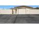 Exterior of the garage and private walkway of home with driveway at 10713 W Santa Fe Dr, Sun City, AZ 85351