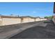 View of garages lining the property's private alley at 10713 W Santa Fe Dr, Sun City, AZ 85351