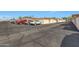 A shot of the parking area with vehicles, garages, and private alley at 10713 W Santa Fe Dr, Sun City, AZ 85351