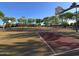 A neighborhood basketball court with multiple hoops and shade trees for pleasant play at 10846 E Quartet Ave, Mesa, AZ 85212