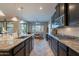 Gourmet kitchen featuring an island with bar seating and seamless flow into the breakfast nook at 10846 E Quartet Ave, Mesa, AZ 85212
