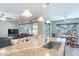 Open concept kitchen featuring a large island with granite countertop and stainless steel sink and pendant lights at 10846 E Quartet Ave, Mesa, AZ 85212