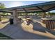 Shaded picnic area with multiple tables and BBQ, perfect for outdoor gatherings at 10846 E Quartet Ave, Mesa, AZ 85212