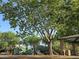 A playground features slides, a climbing structure and a shaded picnic area at 10846 E Quartet Ave, Mesa, AZ 85212