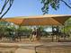 A playground with slides, climbing structures and shade sails, for outdoor fun at 10846 E Quartet Ave, Mesa, AZ 85212