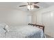 Well-lit bedroom featuring a ceiling fan, closet, and comfortable bed at 1231 W Beacon Ct, Casa Grande, AZ 85122