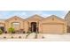 Charming single-story home featuring a desert landscaped front yard and attached two-car garage at 1231 W Beacon Ct, Casa Grande, AZ 85122