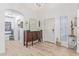Bright foyer featuring wood floors, high ceilings, decorative mirror and lighting at 1231 W Beacon Ct, Casa Grande, AZ 85122