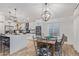 Bright kitchen and dining area features modern cabinets, stainless steel appliances, and stylish light fixtures at 1231 W Beacon Ct, Casa Grande, AZ 85122