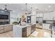Open-concept kitchen features a large island, stainless steel appliances, and modern cabinetry at 1231 W Beacon Ct, Casa Grande, AZ 85122