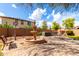 Beautiful backyard featuring a water feature, a built-in grill, and a seating area at 13932 N 135Th Dr, Surprise, AZ 85379