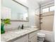 Bright bathroom with a shower-tub combo, granite countertops, and tile accents at 13932 N 135Th Dr, Surprise, AZ 85379