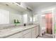 Bathroom featuring a dual sink vanity, granite countertops, and plenty of space at 13932 N 135Th Dr, Surprise, AZ 85379