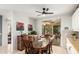 Light-filled dining room featuring a wood table with seating for six and sliding glass doors to the outdoor patio at 13932 N 135Th Dr, Surprise, AZ 85379