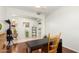 Cozy office space with natural light, dark desk, wood floors, and neutral walls at 13932 N 135Th Dr, Surprise, AZ 85379