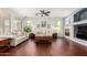 Inviting living room featuring hardwood floors, neutral paint, and ample windows at 13932 N 135Th Dr, Surprise, AZ 85379