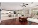 Open concept living room and kitchen area with ample seating and natural light at 13932 N 135Th Dr, Surprise, AZ 85379