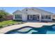 Backyard with a swimming pool, covered patio, and well-manicured lawn at 1394 E Grand Canyon Dr, Chandler, AZ 85249