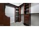 Walk-in closet featuring custom wood shelving and ample hanging space at 1394 E Grand Canyon Dr, Chandler, AZ 85249