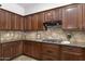 Well-designed kitchen with granite countertops, gas range, and ample cabinet space at 1394 E Grand Canyon Dr, Chandler, AZ 85249