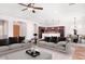 Open living room with neutral tones and easy access to the kitchen and dining areas at 1394 E Grand Canyon Dr, Chandler, AZ 85249