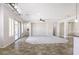 Bright living room with tile flooring, recessed lighting, and access to the backyard at 1394 E Grand Canyon Dr, Chandler, AZ 85249