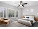 Serene main bedroom featuring light gray walls, plush carpet and bright natural light at 1394 E Grand Canyon Dr, Chandler, AZ 85249