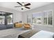 Large bedroom with sliding glass door to the backyard and shuttered windows at 1394 E Grand Canyon Dr, Chandler, AZ 85249